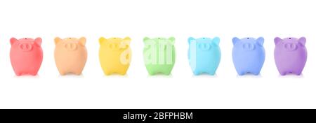 Colorful piggy banks on white background. Money savings concept Stock Photo