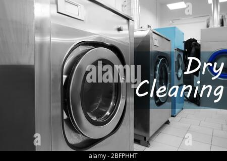 Concept of dry cleaning service. Washing machines in professional laundry Stock Photo