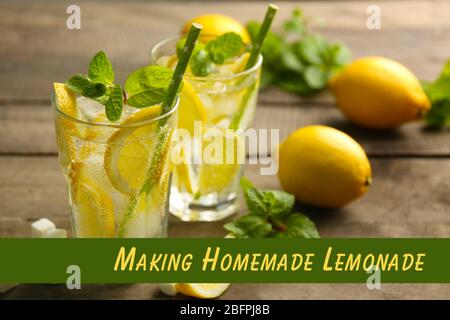 Glasses of refreshing drink with lemon and mint on wooden table. Text MAKING HOMEMADE LEMONADE on background Stock Photo