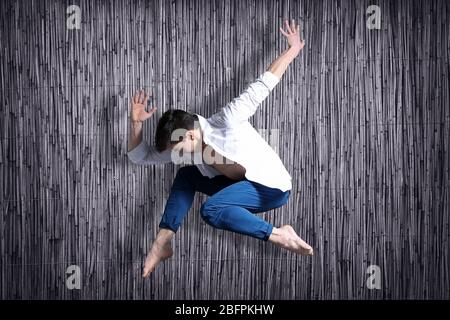 Young dancer on bamboo background Stock Photo