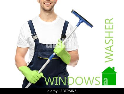 Young window cleaner with squeegee on white background Stock Photo