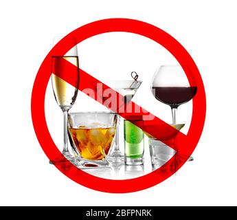 Different alcohol drinks in glasses with STOP sign on white background Stock Photo