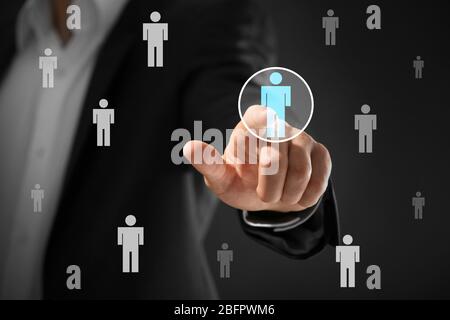 Man working with virtual screen, closeup. Concept of human resources management Stock Photo