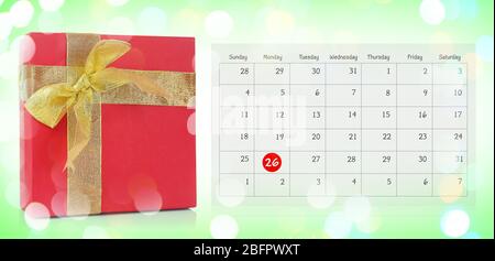 Boxing Day concept. Gift and calendar on color background Stock Photo