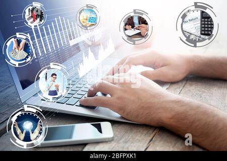Man working with laptop at table. Concept of business and modern technology Stock Photo