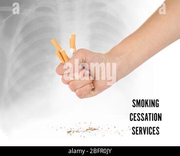 Text SMOKING CESSATION SERVICES and woman crushing cigarettes on light background Stock Photo