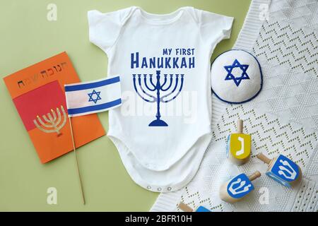 Festive set for baby's first Hanukkah on color background Stock Photo