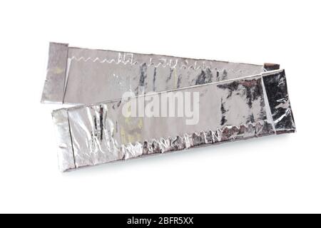 two chewing gums wrapped in standard silver foil, isolated on white Stock Photo