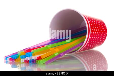 red glass with straws isolated on white Stock Photo