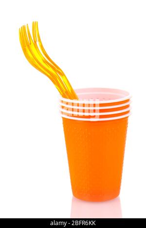 Bright orange plastic cups and forks isolated on white Stock Photo