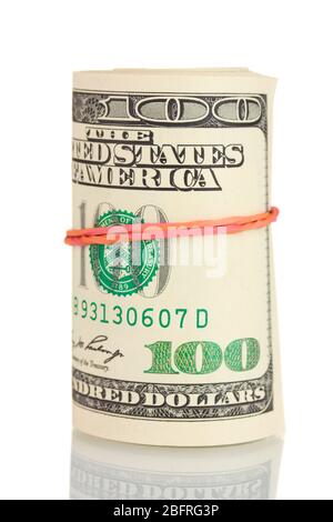 A lot of one hundred dollar bills tied rubber band isolated on white Stock Photo