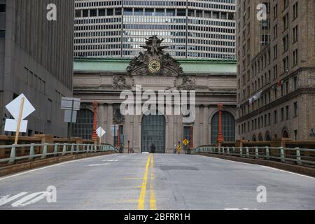 The roadway on Park Avenue leading through Grand Central Terminal is nearly empty of traffic due to health concerns to stop the spread of Coronavirus Stock Photo