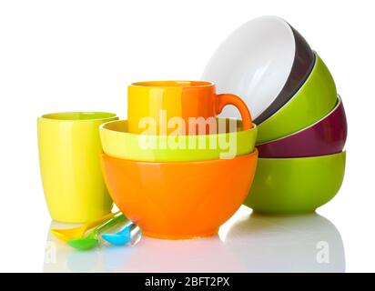 bright empty bowls, cups and spoons isolated on white Stock Photo