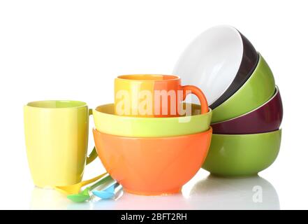 bright empty bowls, cups and spoons isolated on white Stock Photo