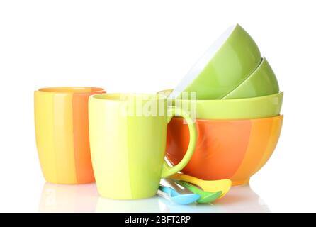 bright empty bowls, cups and spoons isolated on white Stock Photo