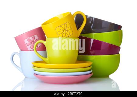bright empty bowls, cups and plates isolated on white Stock Photo
