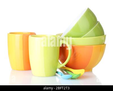 bright empty bowls, cups and spoons isolated on white Stock Photo
