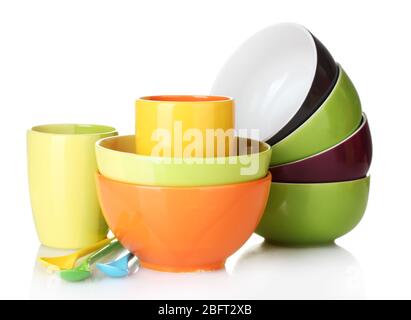 bright empty bowls, cups and spoons isolated on white Stock Photo