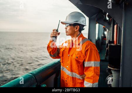 Filipino deck Officer on deck of vessel or ship , wearing PPE personal protective equipment Stock Photo