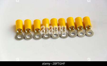 electrical crimp terminal connector. metal terminals isolated on white background. tips for cables and wires.  Stock Photo