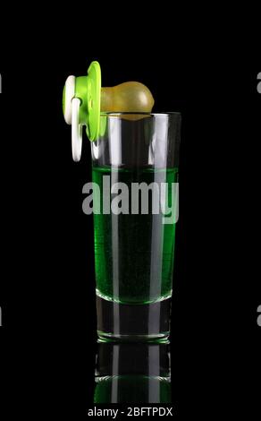 Baby dummy with alcoholic beverage isolated on black Stock Photo