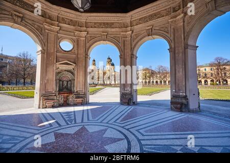 Hofgarten with view of the Theatine Church in spring, deserted, curfew due to Corona crisis, Munich, Upper Bavaria, Bavaria, Germany Stock Photo