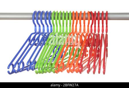 plastic hangers in row  isolated on white Stock Photo