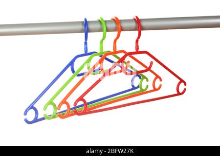 plastic hangers in row  isolated on white Stock Photo