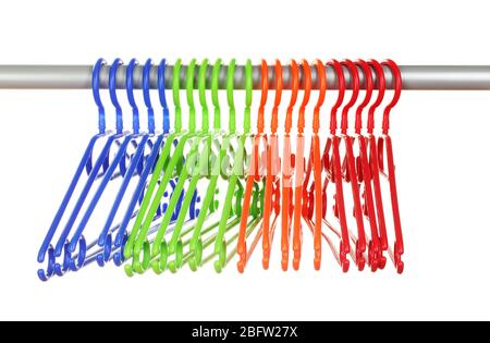 plastic hangers in row  isolated on white Stock Photo