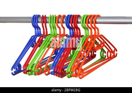 plastic hangers in row  isolated on white Stock Photo