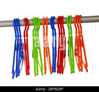 plastic hangers in row  isolated on white Stock Photo