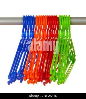 plastic hangers in row  isolated on white Stock Photo