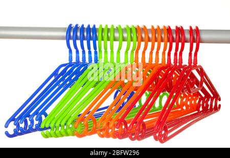 plastic hangers in row  isolated on white Stock Photo