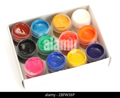 jars with colorful gouache in paper box isolated on white background Stock Photo