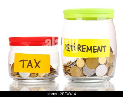 Glass banks for tips with money isolated on white Stock Photo