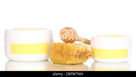 Jars of cream with honey isolated on white Stock Photo