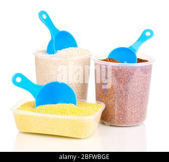 Measuring spoons and plastic containers with grain isolated on white Stock Photo