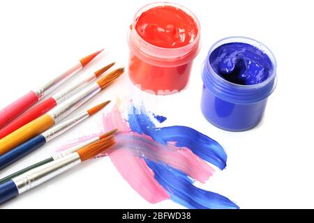 Abstract gouache paint and brushes, isolated on white Stock Photo - Alamy