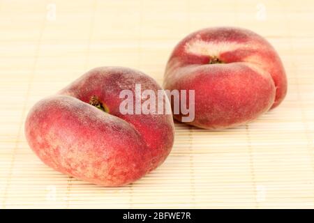 ripe fig peaches on bamboo mat Stock Photo