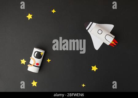 Spaceship, shuttle, rocket and astronaut on black background with copy space for text. Concept of business launch, start up, handcraft, diy, creative Stock Photo