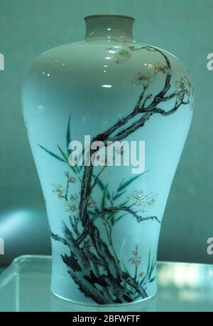 A small plum vase with a pastel plum and bamboo pattern during the Qianlong period of the Qing Dynasty the Guangxi Zhuang Autonomous Region Museum on Stock Photo