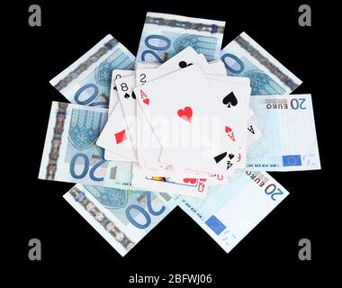 Euro and a deck of playing cards isolated on black Stock Photo