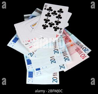 Euro and a deck of playing cards isolated on black Stock Photo