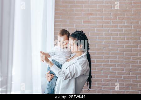 Mom with son cuddling Stock Photo
