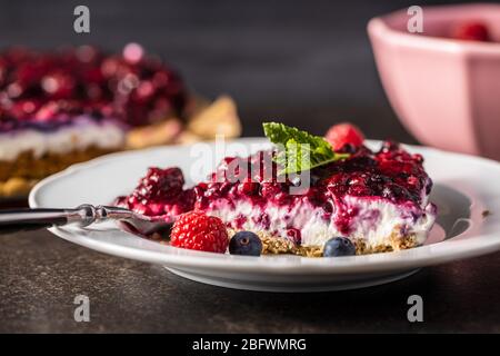 Sweet berry cake. Pie with blueberries and raspberries on plate. Stock Photo