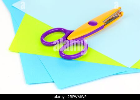 Premium Photo  Colorful zigzag scissors with color paper isolated on white