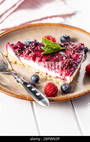 Sweet berry cake. Pie with blueberries and raspberries on plate. Stock Photo
