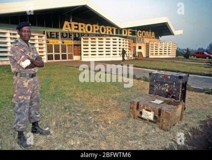 1994 - A member of the Zaire armed forces stands in front of the terminal building at the Goma Airport.  The U.S. military flew in vital water purification equipment and relief cargoes to assist in the humanitarian effort. Stock Photo