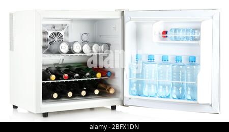 Mini fridge full of bottles of alcoholic beverages and water isolated on white Stock Photo