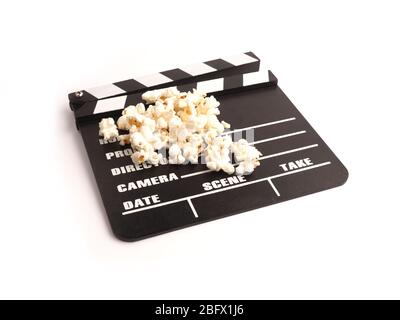 Clapper board with popcorn on a white studio background Stock Photo